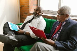 Gentlemen reading reports