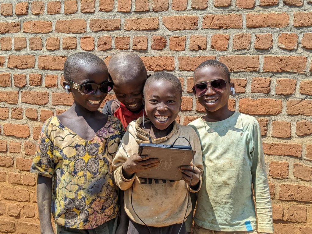 Boys smiling using tablet - via Grace Kaley @ Pexels